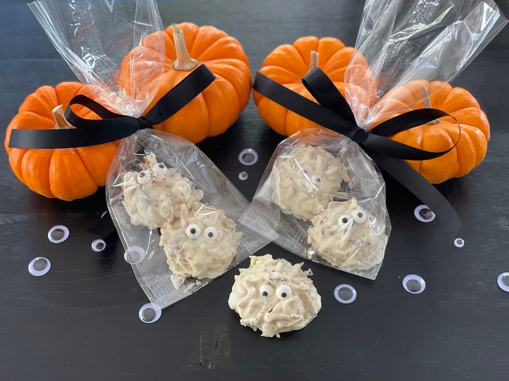 Ghostly Halloween treats are made with white chocolate, chow mein noodles, sliced almonds, and dressed with candy eyes.