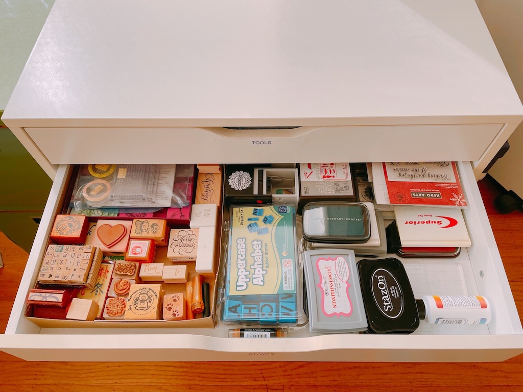 Wide but shallow drawers make it easy to find craft supplies; it helps to identify what's in each drawer using a label maker.
