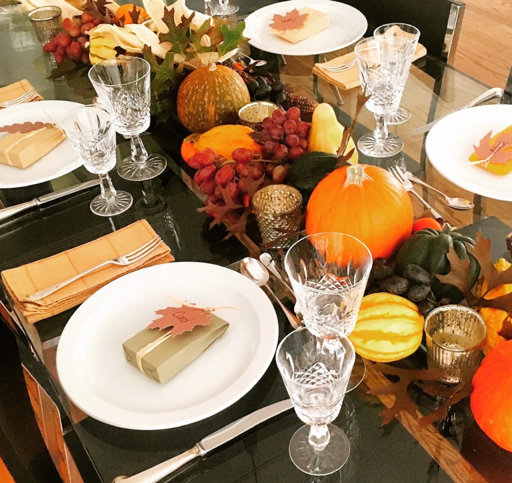 Thanksgiving table is set with a variety of squash that you can cook and eat later.