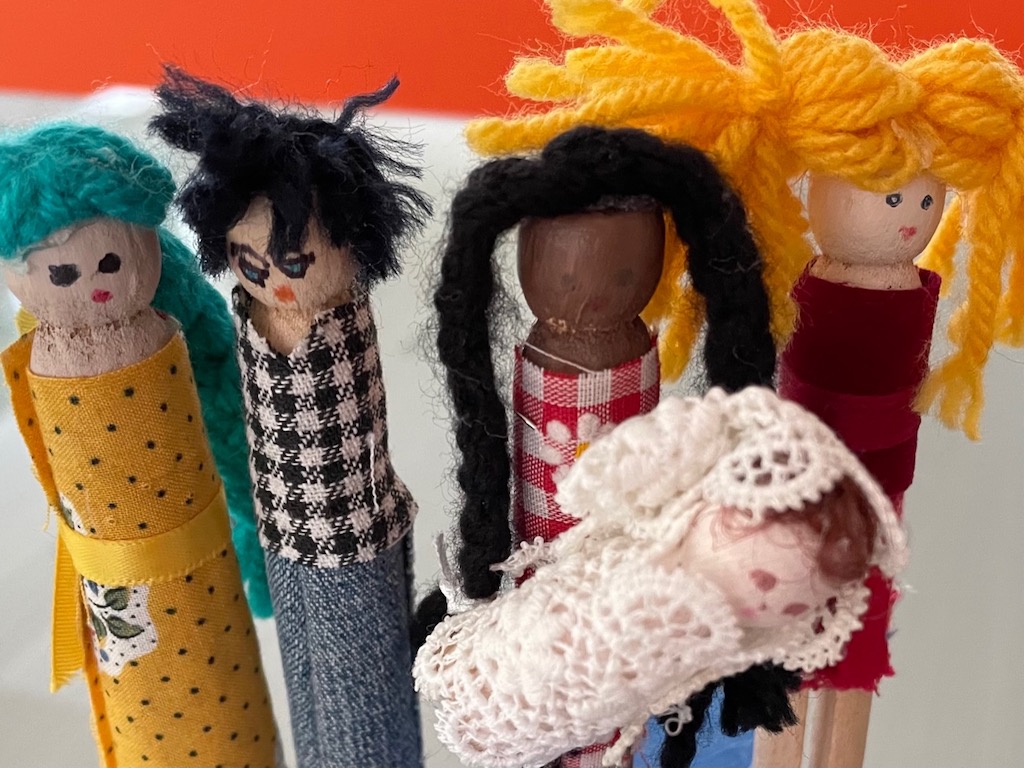 Clothespin doll family inhabits the shoebox house.
