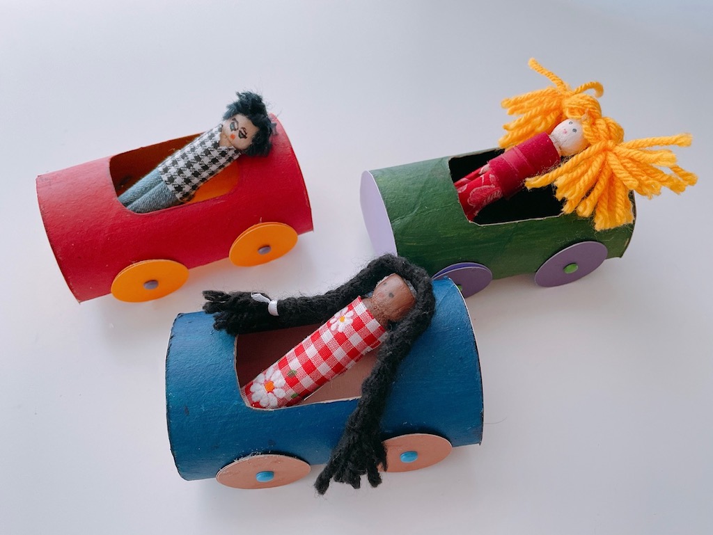 The clothespin family take a ride in their new cars.