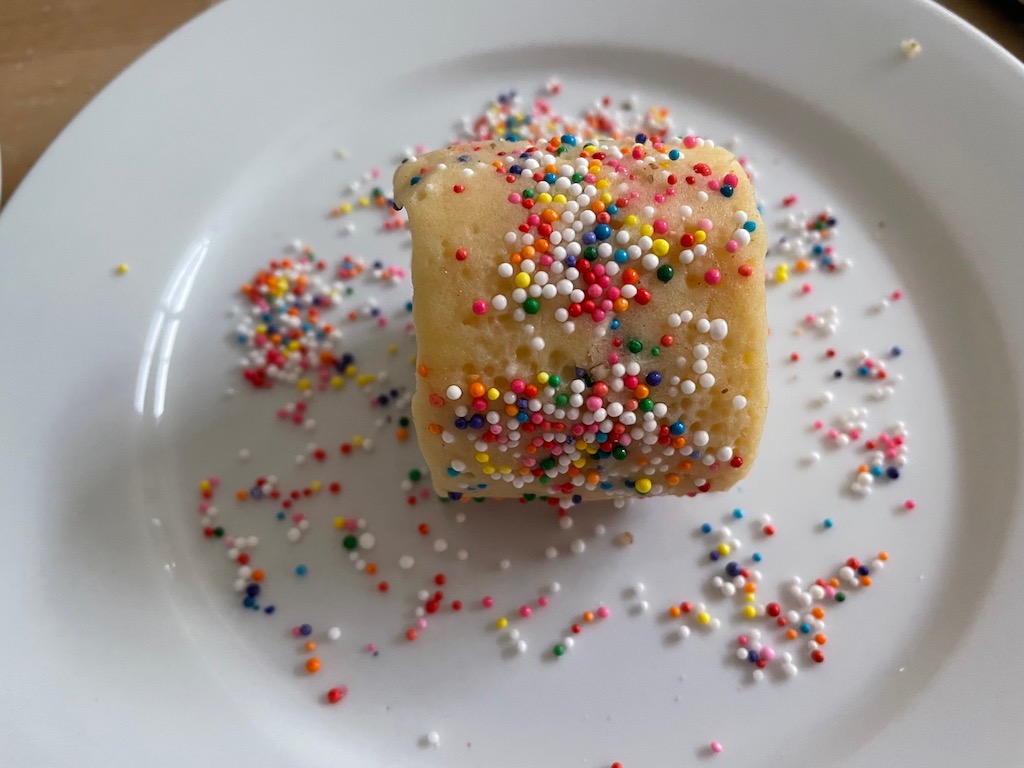 To edge cookies decoratively, roll the dough log in a plate of sprinkles. Press in place. For variety, cut log into section and roll each section in a different topping.