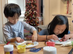 Kids decorating Christmas cookies.