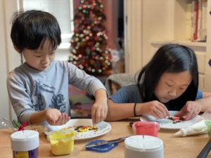 Kids decorating Christmas cookies.