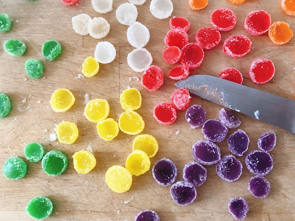 Slice gumdrops crosswise before gluing with icing to cardboard cones or ice cream cones.