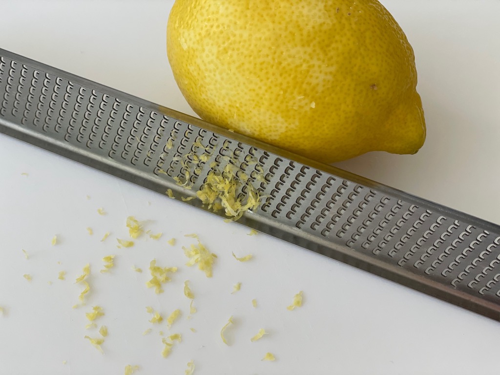 A Microplane zester makes very fine zest. It's easy to use and easy to clean.
