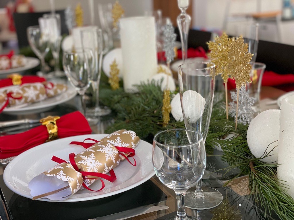 The grandchild's place setting features a squat wine glass for her drink.