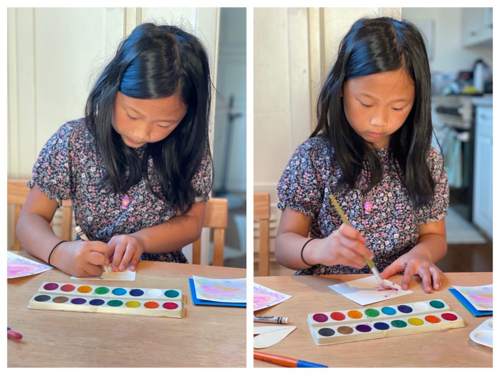 At left, child traces the heart shape with a crayon; at right, she paints over the area with watercolors.