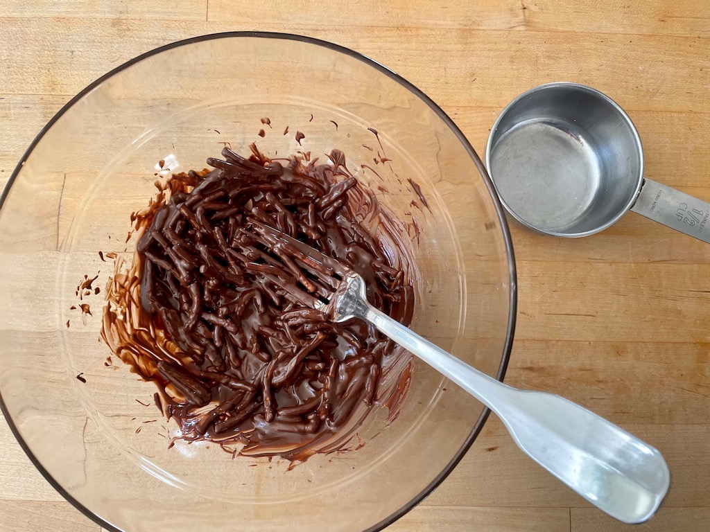 Combine melted chocolate chips with chow mein noodles to make Easter egg nests.