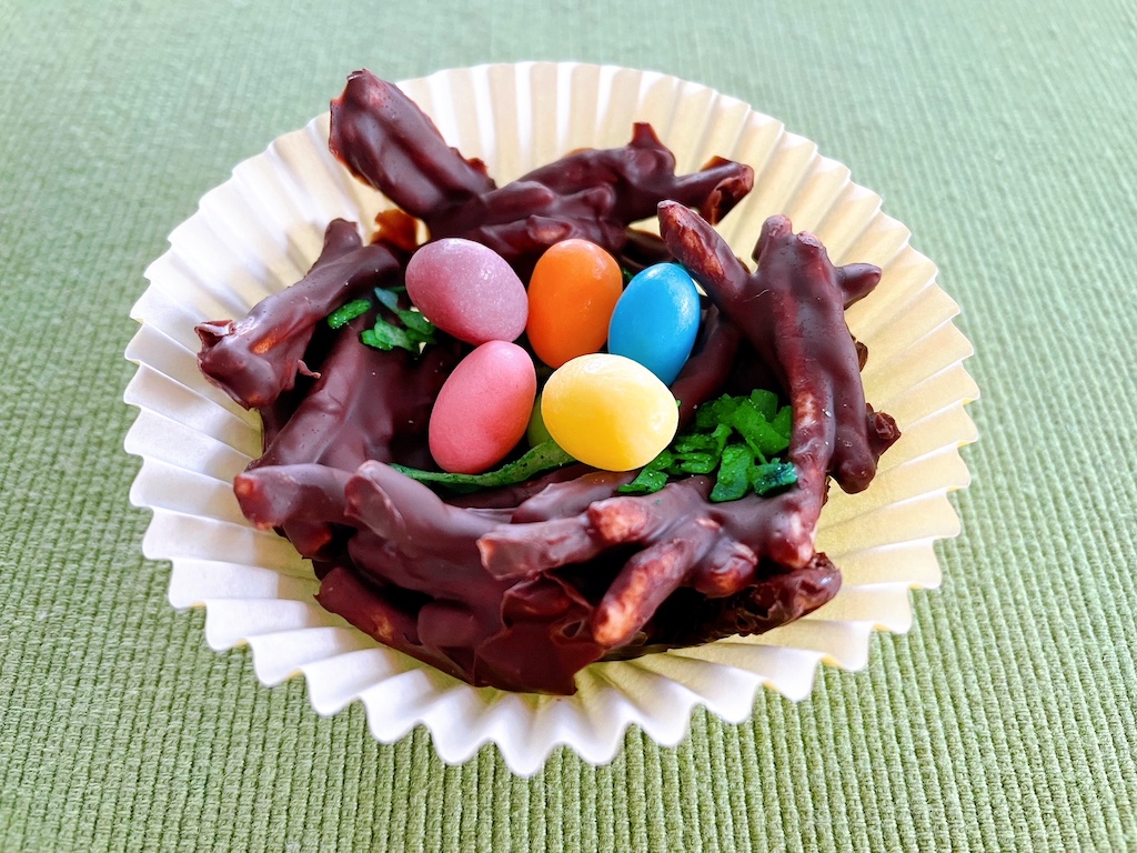 SweetTARTS jelly bean eggs fill this Easter egg nest; serve in fluted paper cupcake wrappers.
