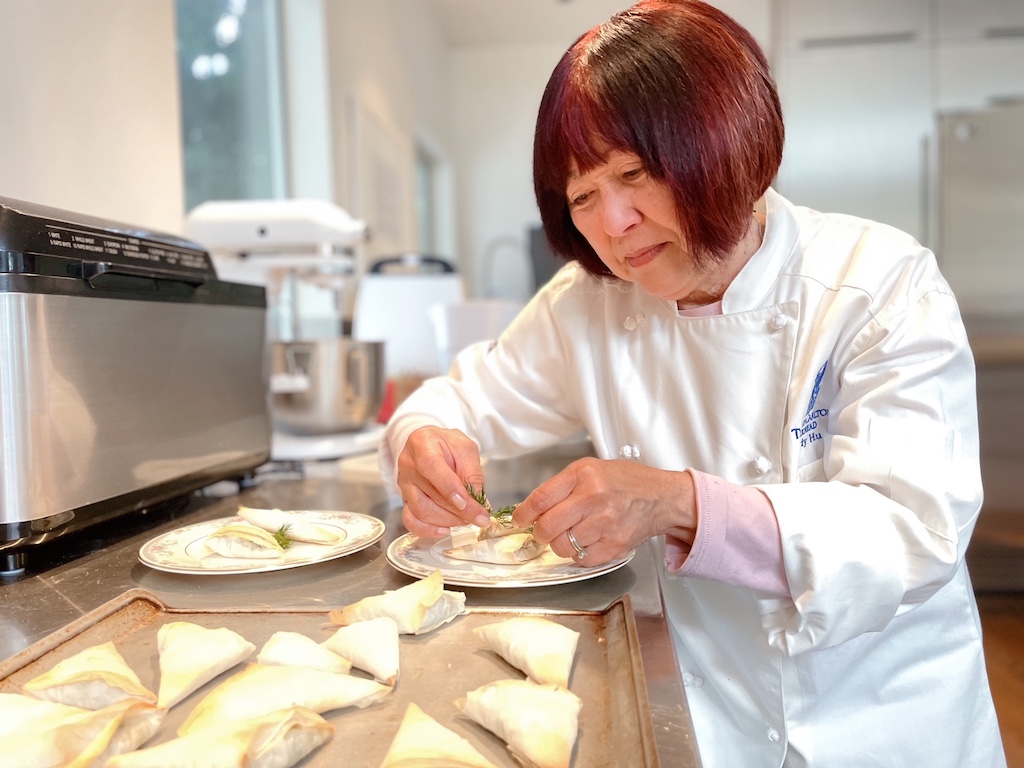 Grandma plays chef, garnishing the amuse-bouche.