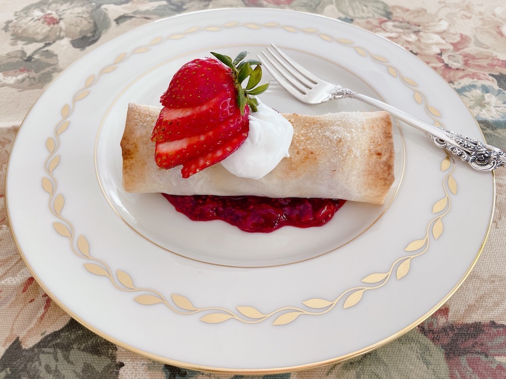 The dessert: strawberries stuffed in a phyllo roll and served with raspberry sauce.