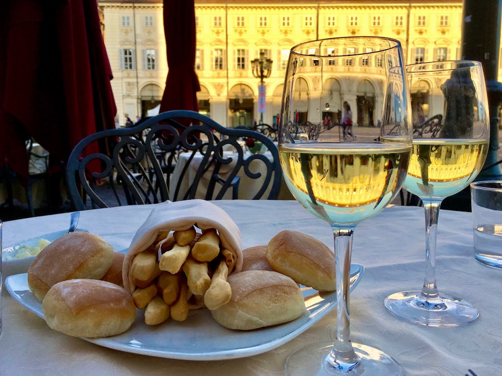 A glass of wine...breadsticks...start planning an Italian cooking marathon at home if you can't go to Italy this year.