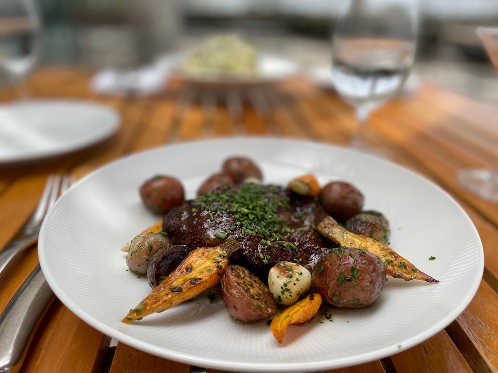 Eating outdoors figures into a Covid-cautious vacation. This flat iron steak is from the Restaurant at Getty Center.