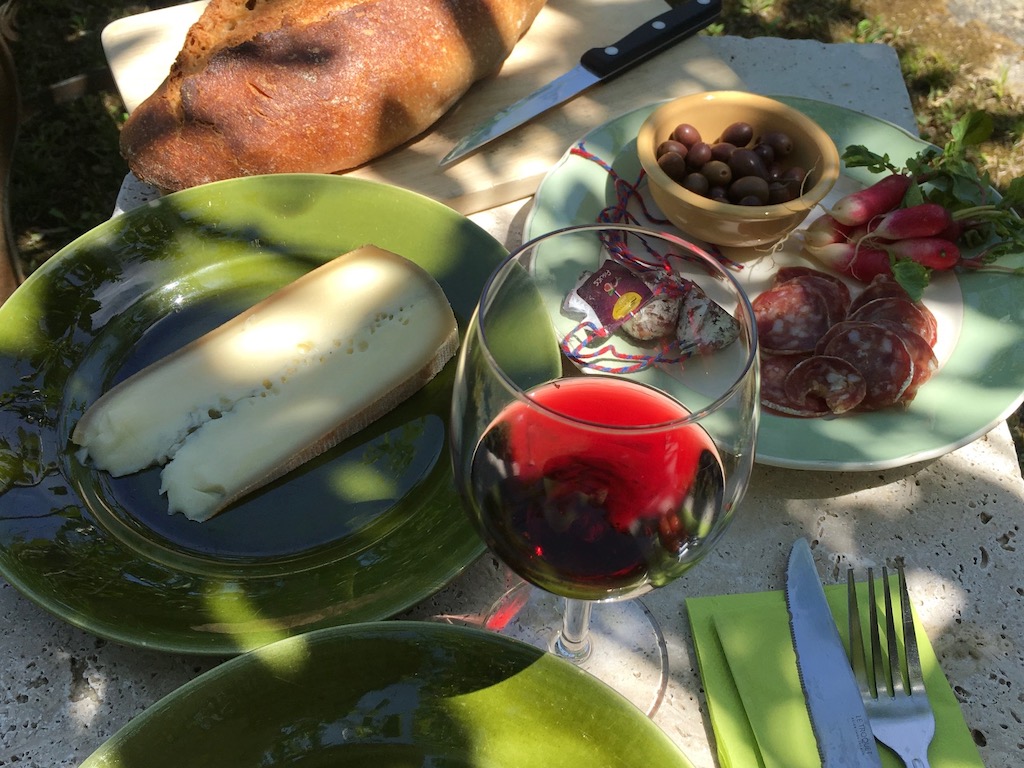 A picnic in France after a farmers' market foray can be replicated at home as part of a staycation plan.