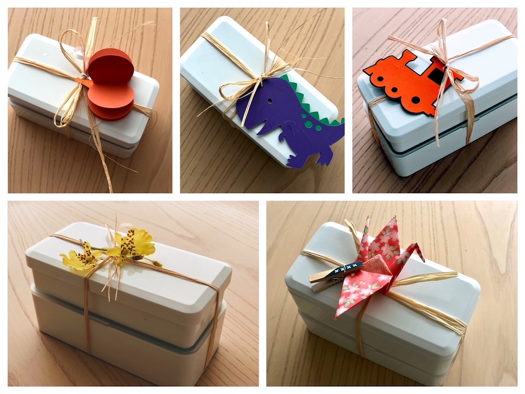A variety of decorated bento boxes made by grandma for preschool grandkids.