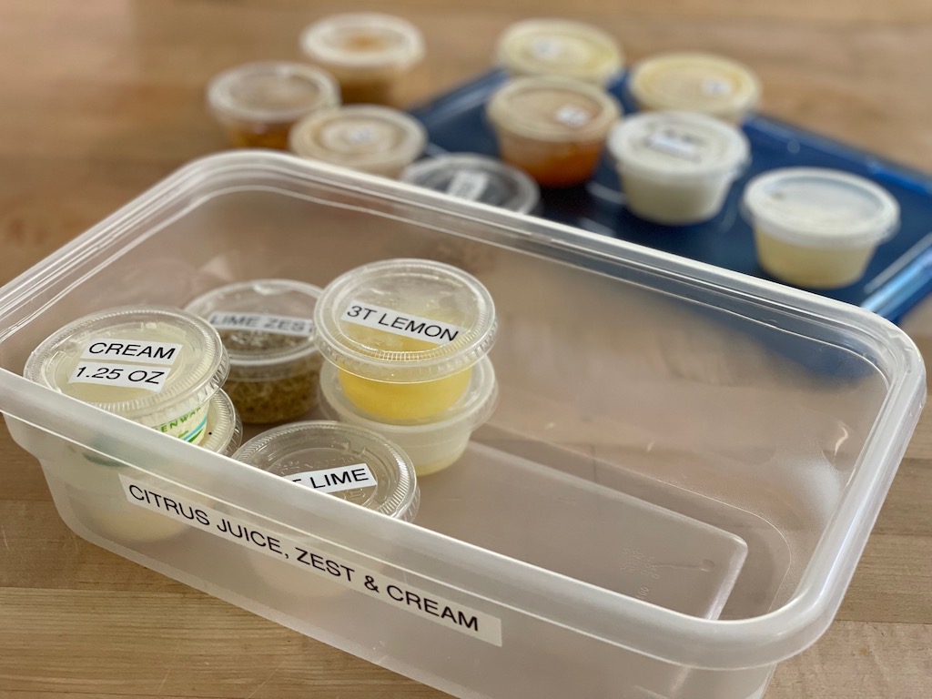 Reuse takeout sauce cups to hold lemon juice, coconut milk, tomato paste, and more for freezing.