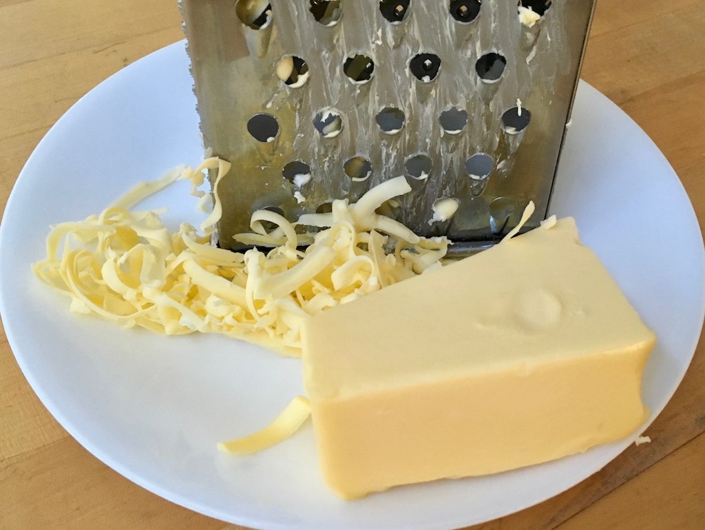 Grate frozen butter on a box grater to soften for baking.