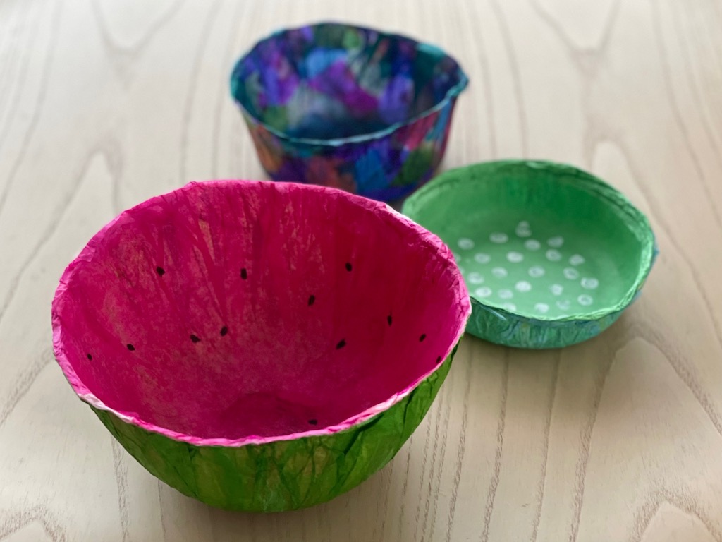 Three tissue paper bowls: watermelon, polka dot, and stained glass.