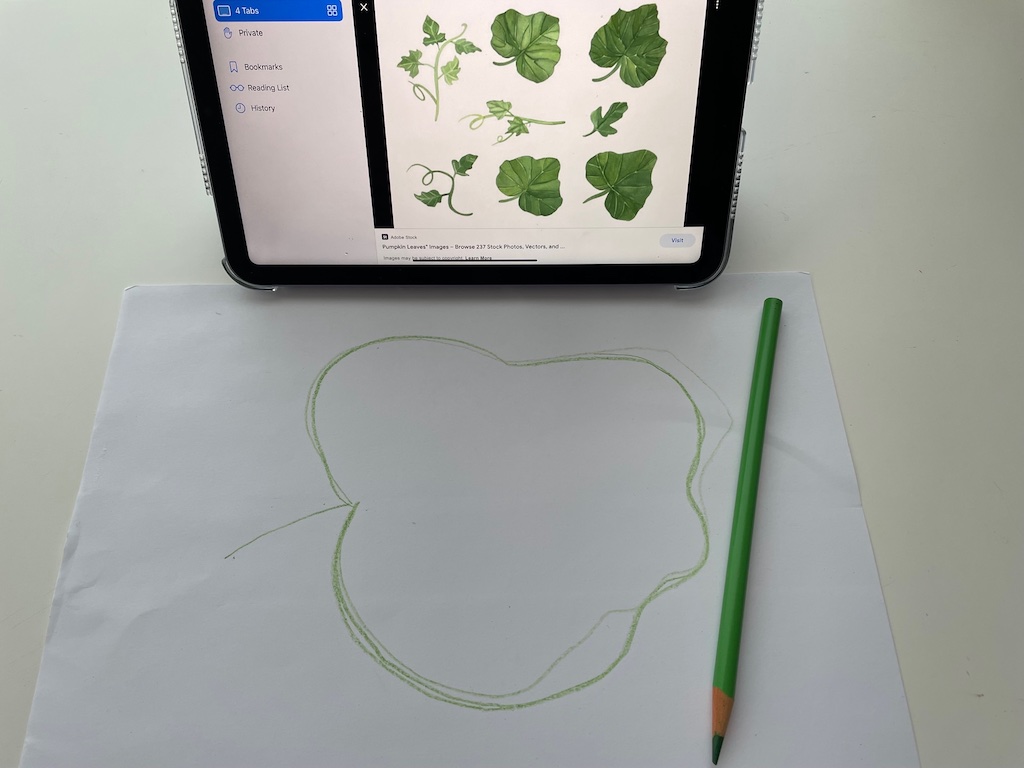Start by drawing a pumpkin leaf pattern using an online illustration as a guide.