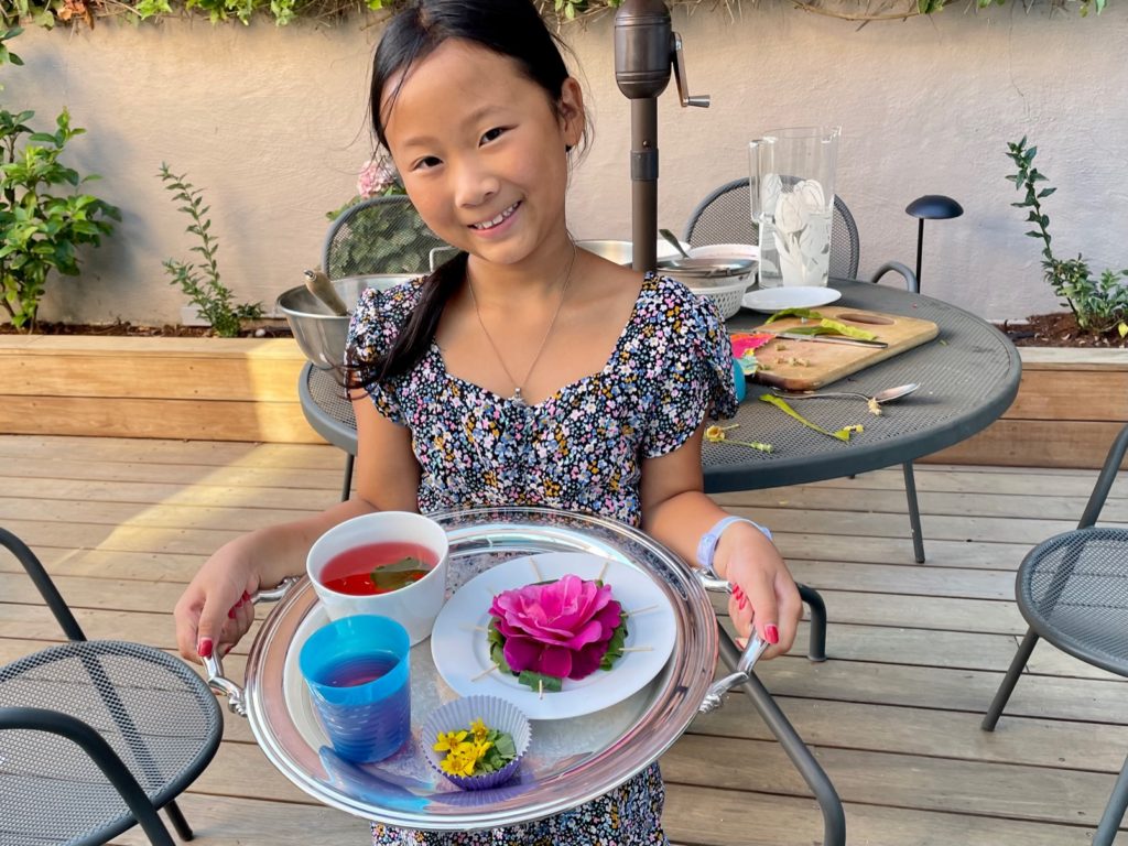 A child's salad of flowers and leaves.