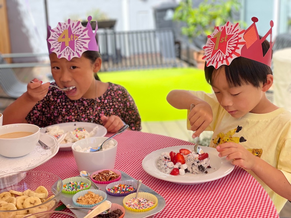 Kids eating ice cream at an ice cream party.