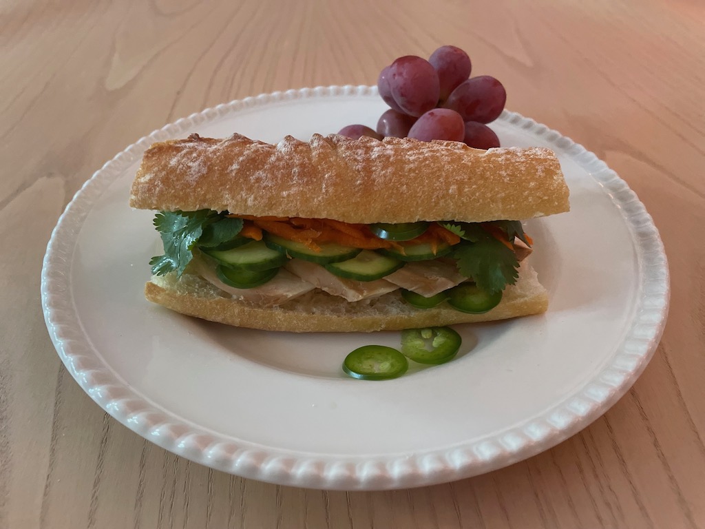 This Vietnamese-inspired sandwich features turkey slices, cucumber, pickled carrots, jalapeño, and cilantro.