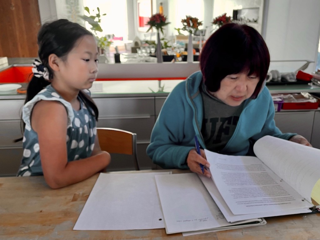 Child and grandma reviewing the holiday menu.