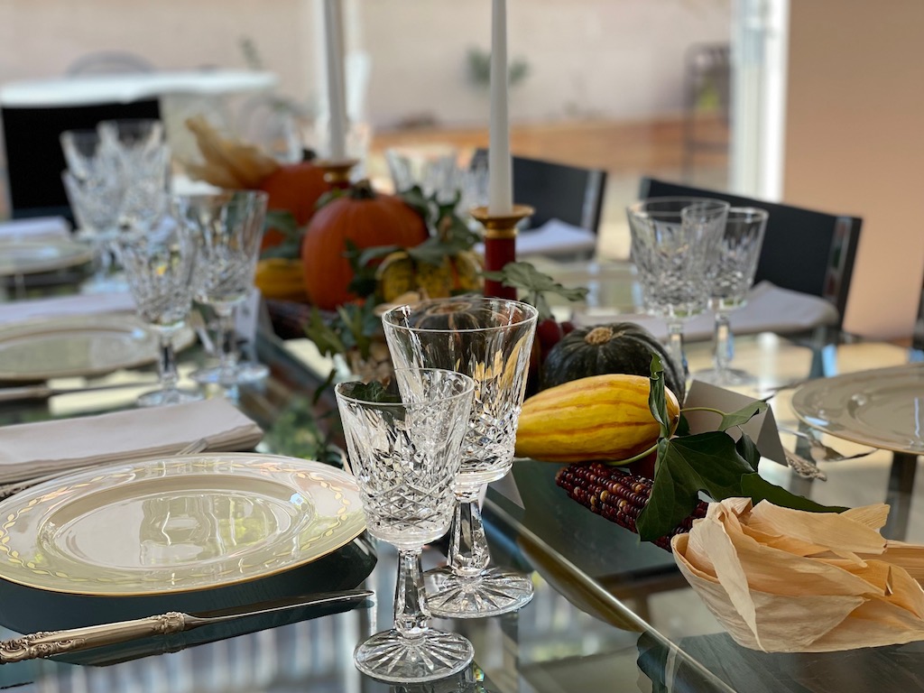 Thanksgiving table with squash, pumpkins, and Indian corn is a holiday tradition.