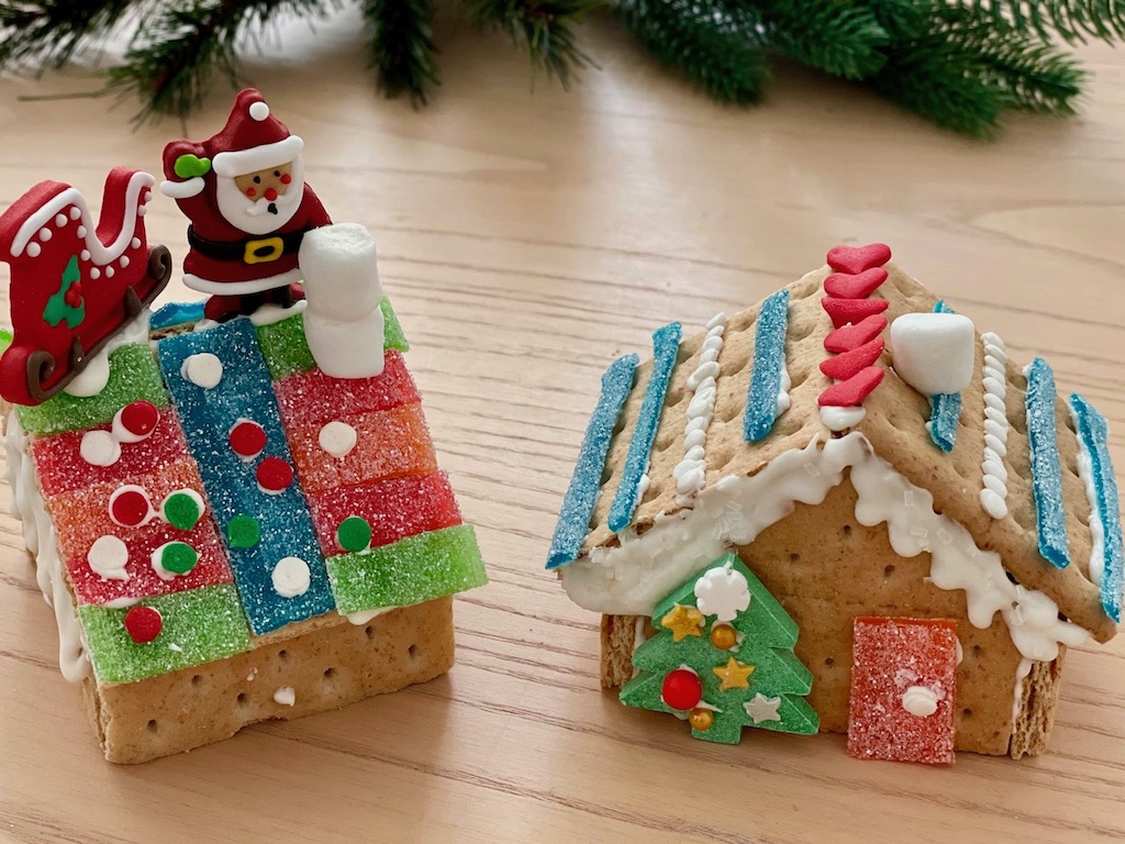 Two "gingerbread" houses made from graham cracker squares instead of gingerbread.