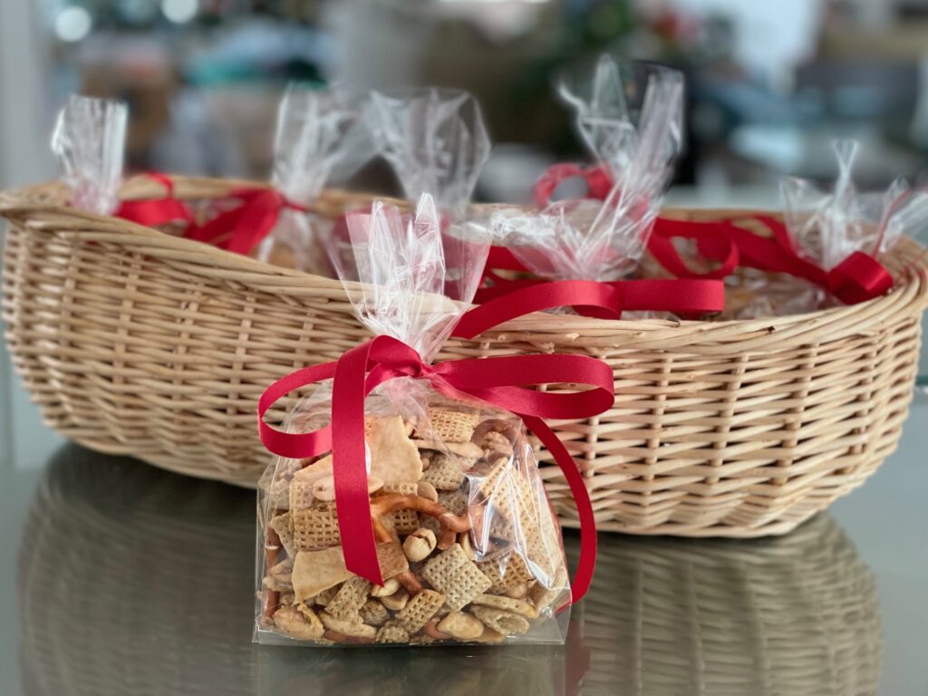 Chex Mix packaged in cellophane bags as refreshments for the gingerbread house party.