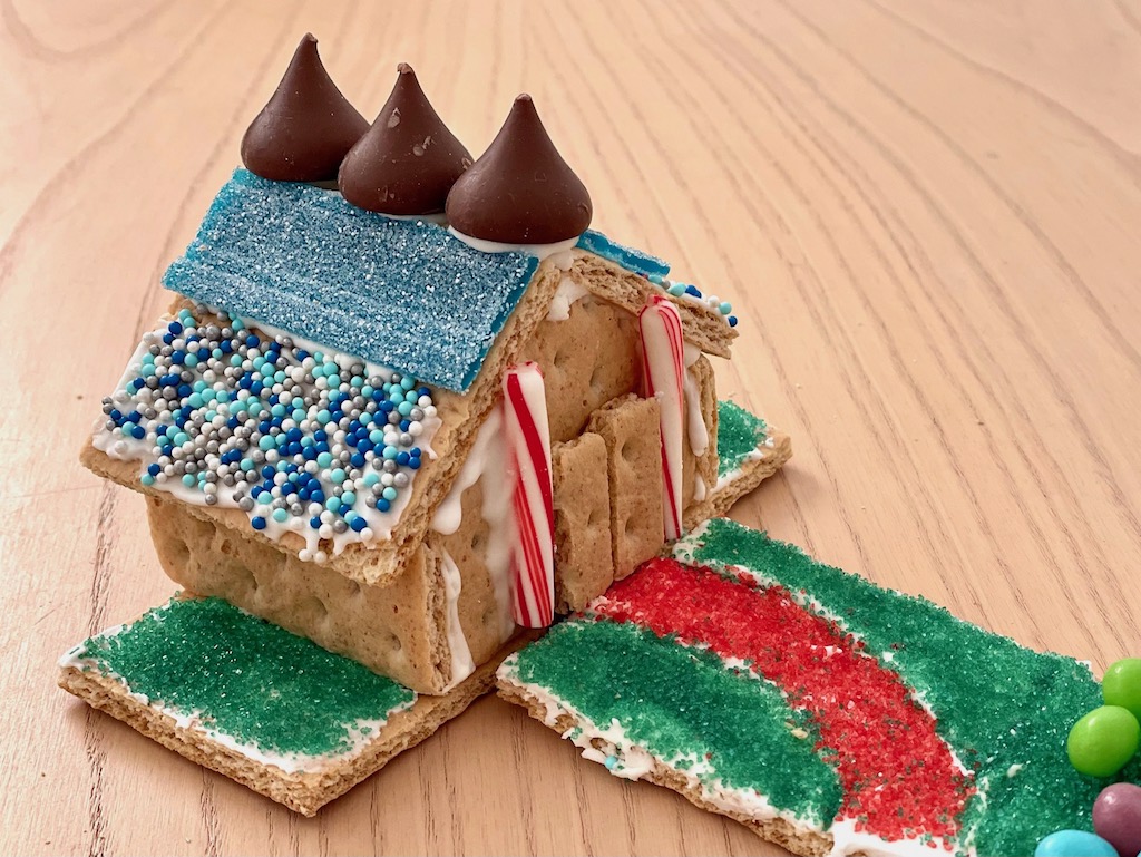 Gingerbread. house with yard and walkway.