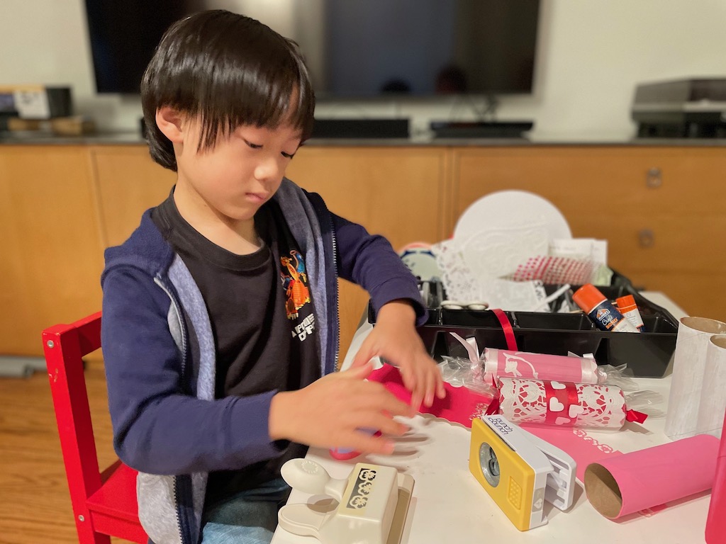 Child making valentines.