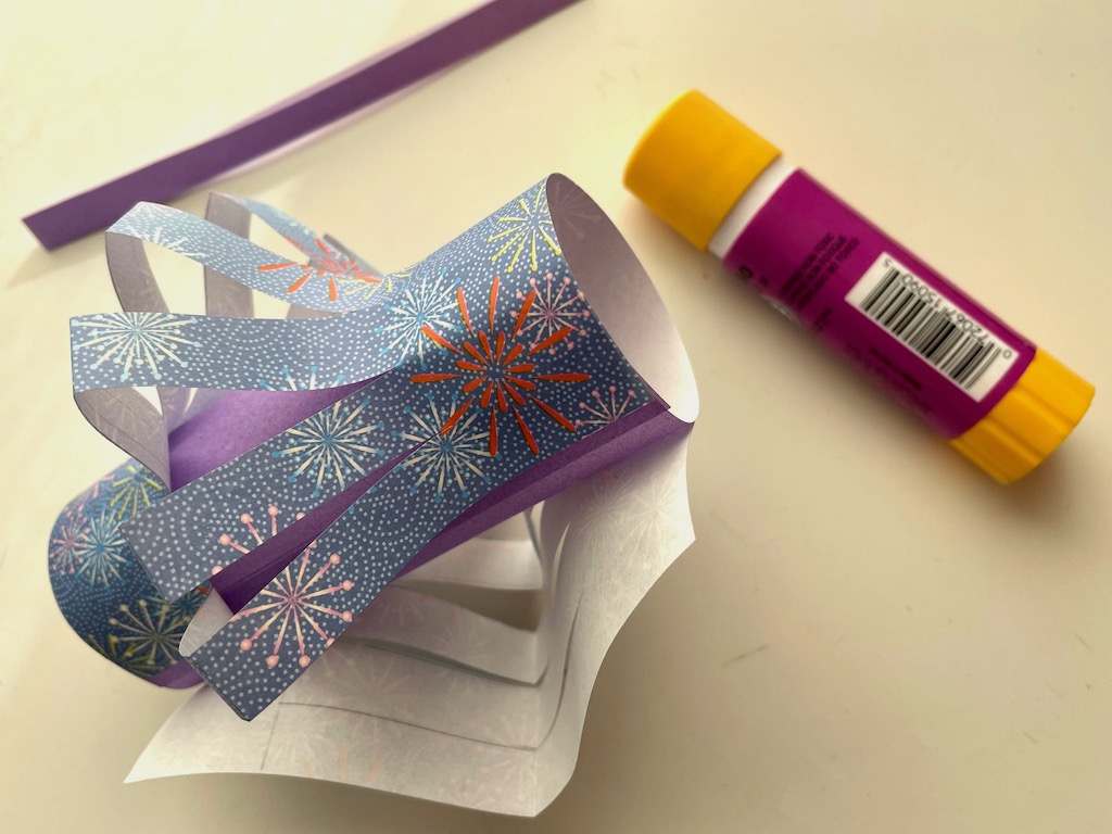 Wrap the printed origami paper around the solid origami paper tube and glue in place.