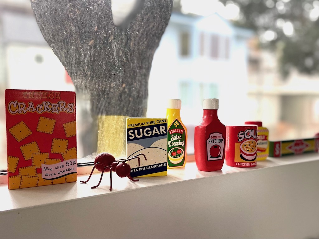 Wooden grocery toys make good pop art in a kitchen.