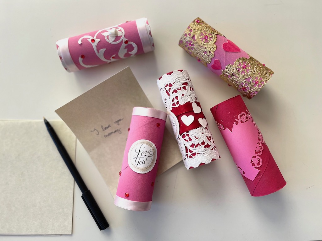Write a note and roll it up; put it into the decorated valentine tube.