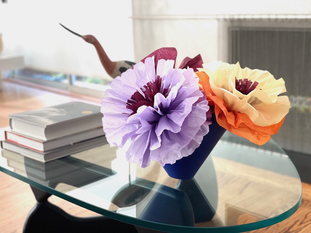 Mexican paper flowers on a coffee table.