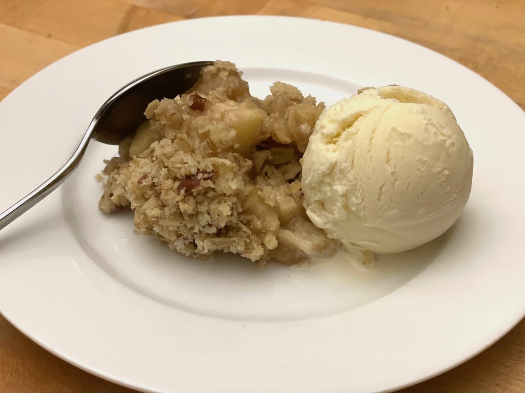 Easy Apple Crisp, made by a six-year-old, is served with vanilla ice cream.