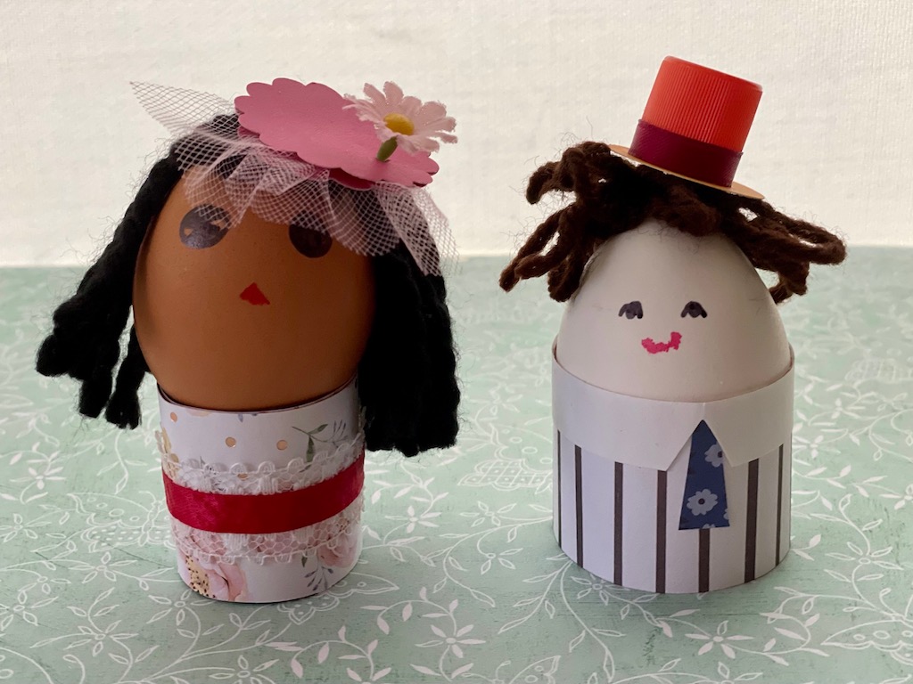 Egg doll dress is decorated with lace and ribbon. The collar and tie  for the egg doll suit are cut from cardstock.