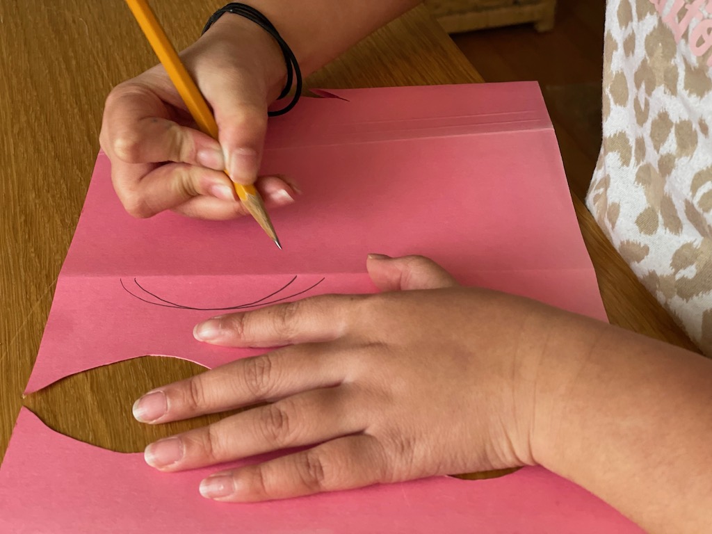 Draw half the fish to the fold line; refold and cut through both thicknesses for the complete fish.