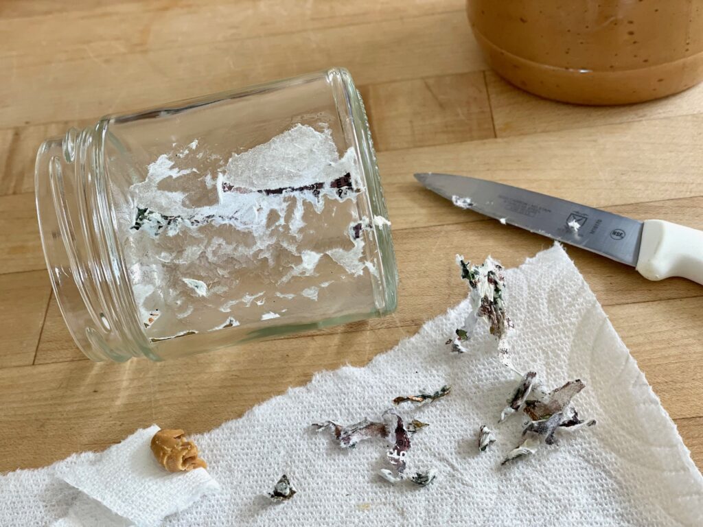 How to remove a label from a jar to make a Mother's Day gift. Soak jar, scrape off label with a paring knife, and remove glue remains with peanut butter.