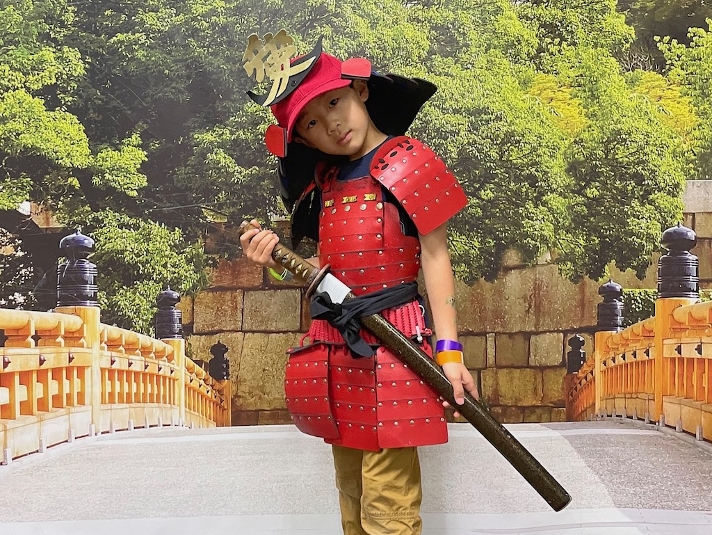 A child in samurai warrior dress at the Samurai and Ninja Museum in Kyoto.