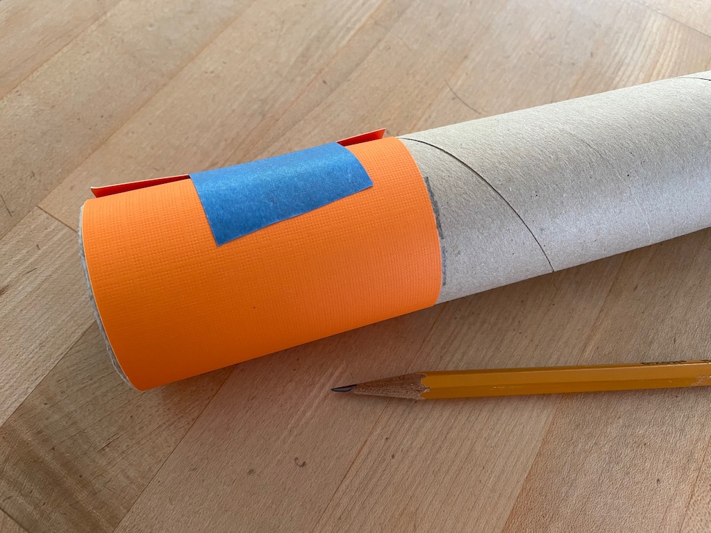To measure 3 inches to cut a gift wrap tube, cut a strip of paper 3 inches wide, tape to the tube, then mark with pencils.