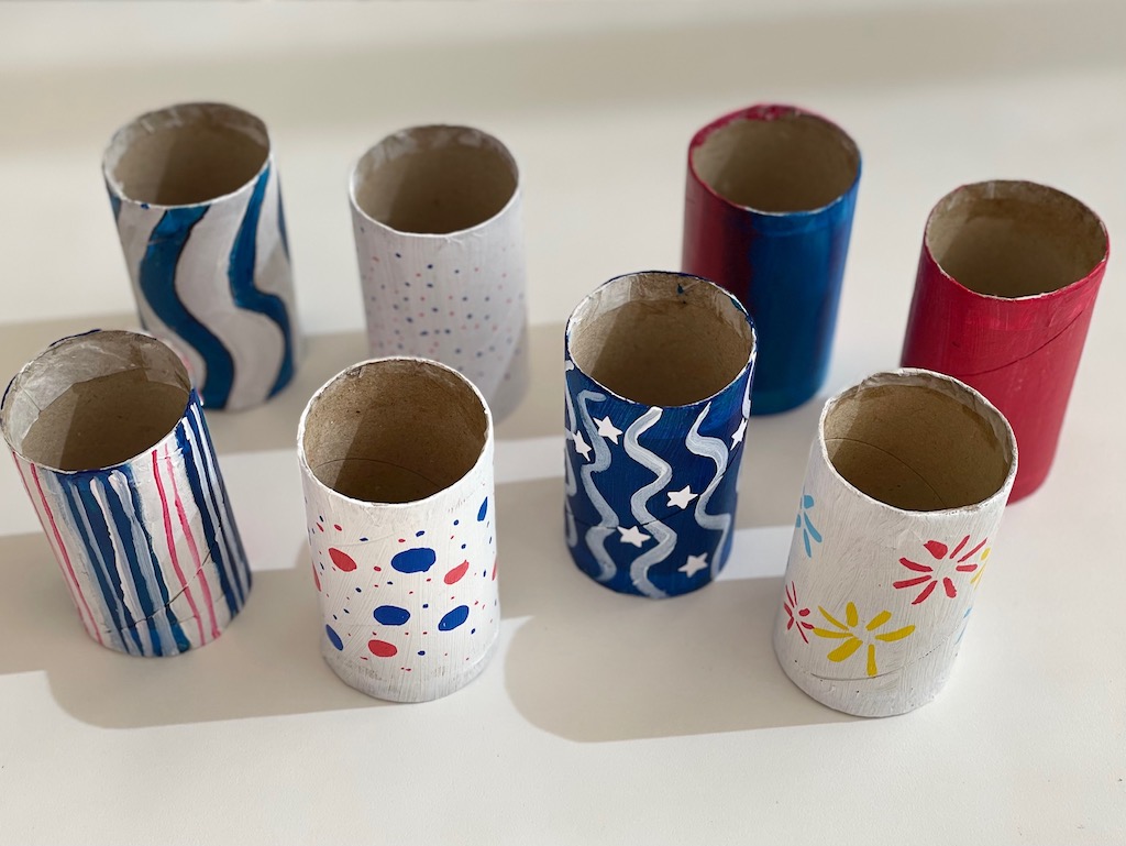 A collection of DYI napkin rings in red, white, and blue for the Fourth of July.