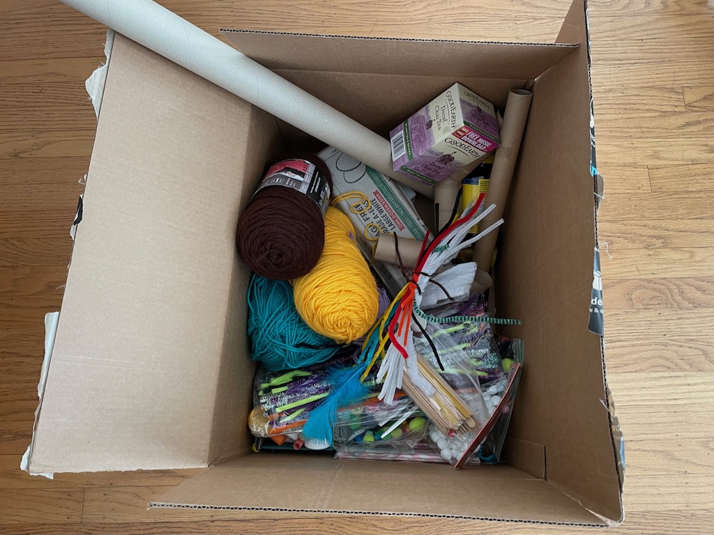 Store materials in a carton so kids can rummage through to create their puppets.