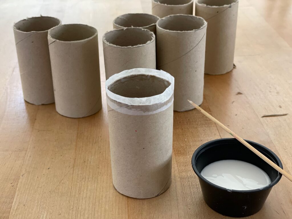 Cut tubes have ragged edges. Wrap the edges in a strip of tissue paper using white school glue applied with a bamboo skewer.