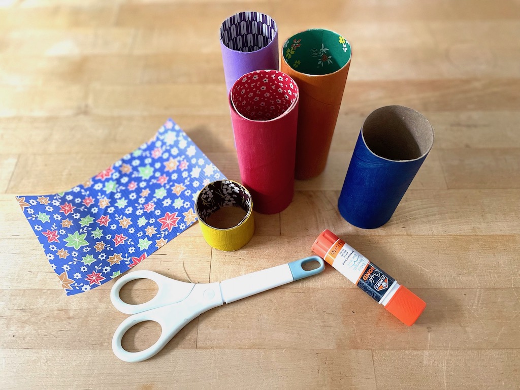 Use different origami papers to line the toilet paper rolls. Hold in place with glue from a glue stick.
