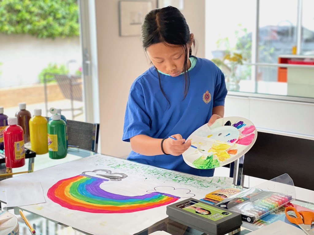 Use large sheets of paper to make background scenery for the puppet theater. Use poster paints, markers, colored pencils and crayons.