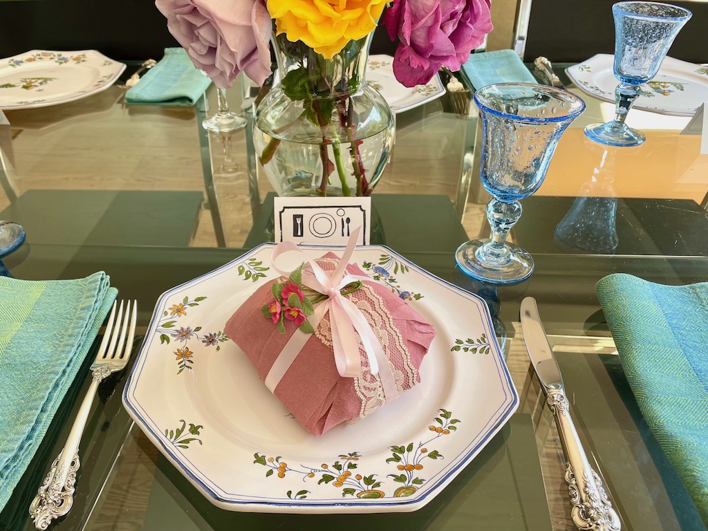 Set the table for a child's birthday as for an adult dinner party to make the dinner special. The gift is a surprise ball, filled with trinkets and with a cash gift inside.
