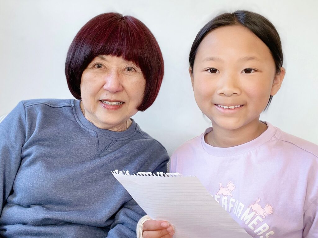 Child interviews grandma to gain family history knowledge that will be preserved on video for the future.